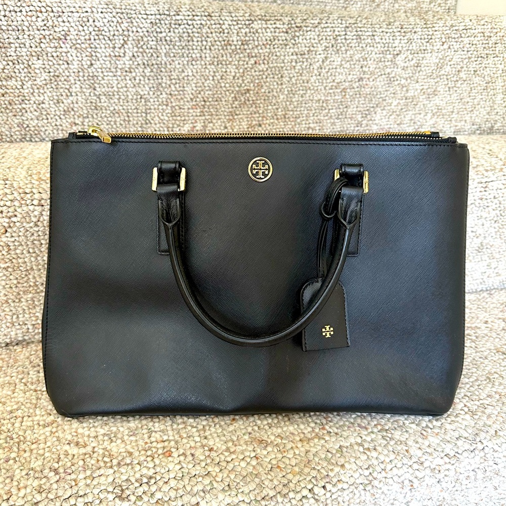 Tory Burch black briefcase with arm or removable shoulder strap.